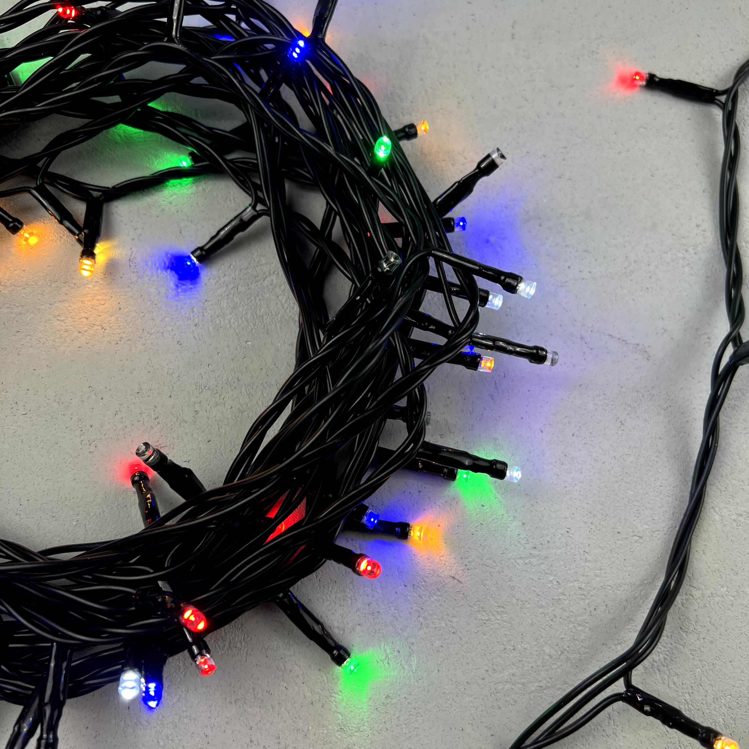 Гирлянда Нить 10м Разноцветная с Мерцанием Белого Диода 24В, 100 LED, Провод Черный ПВХ, IP54 PST100BLW-11-1M