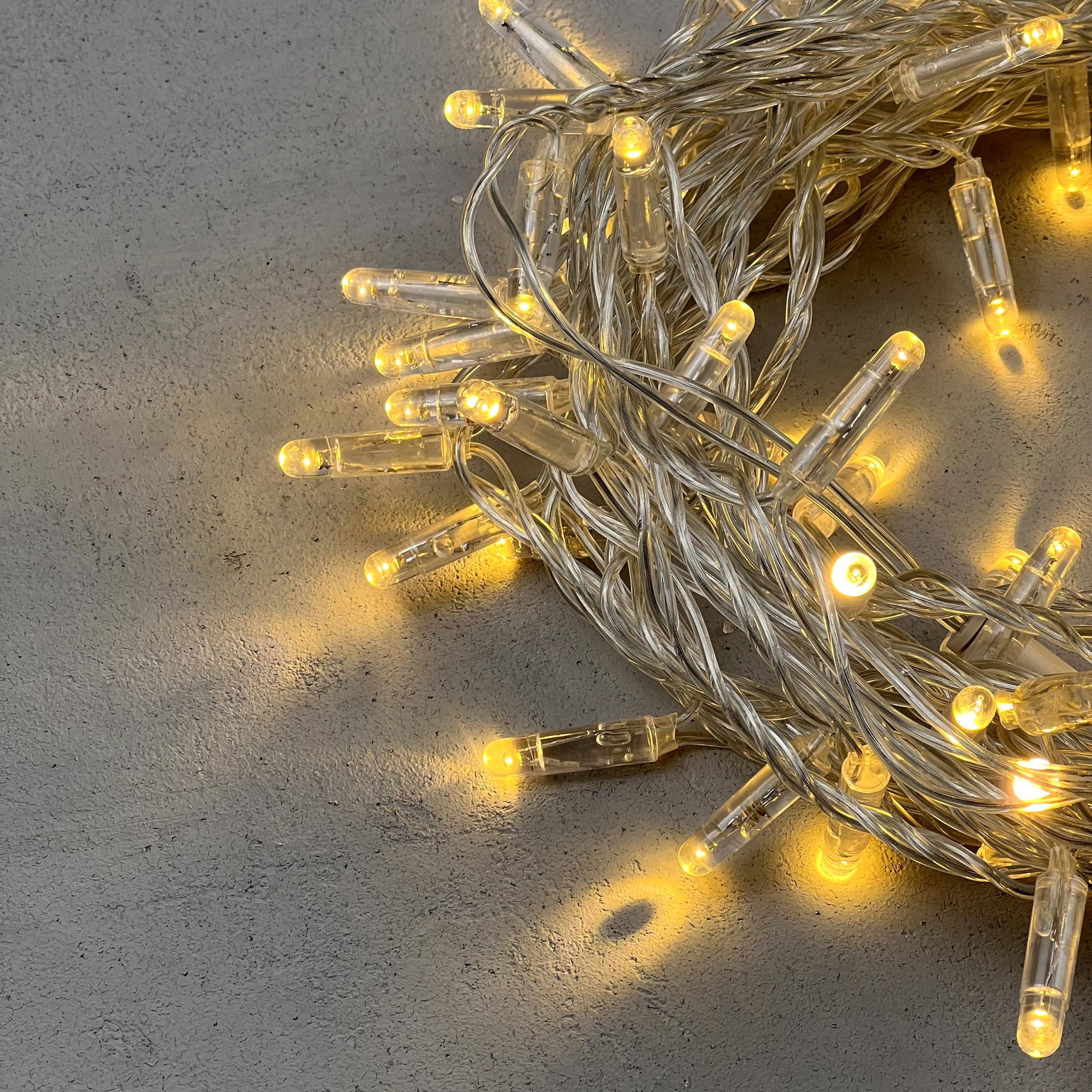 Гирлянда Нить с Колпачком 10м Тепло-Белая 24В, 100 LED, Провод Прозрачный ПВХ, IP65 PST100CAP-10-1WW