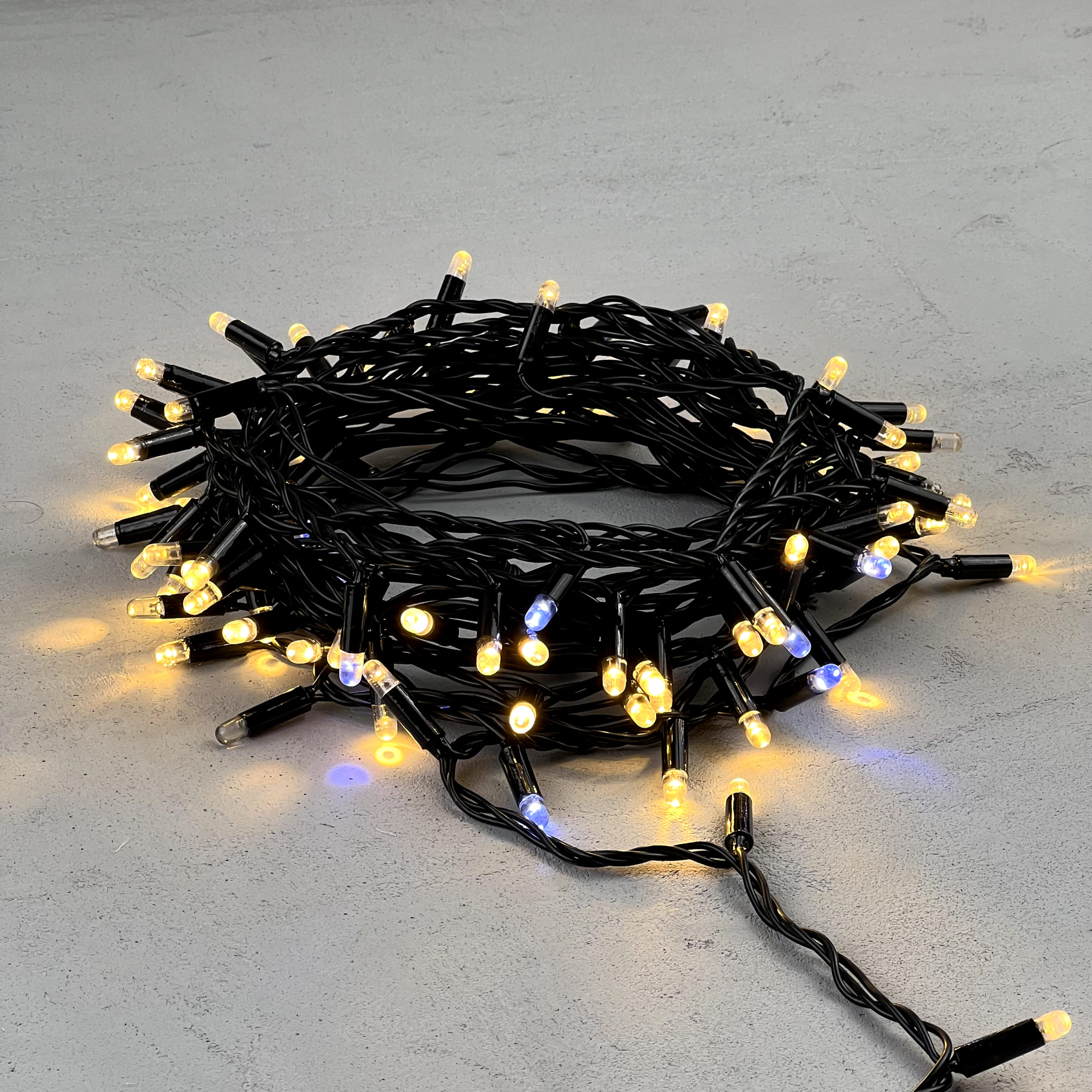 Гирлянда Нить с Колпачком 10м Тепло-Белая с Мерцанием Белого Диода 220В, 100 LED, Провод Черный ПВХ, IP65 PST100BLWCAP-11-2WW