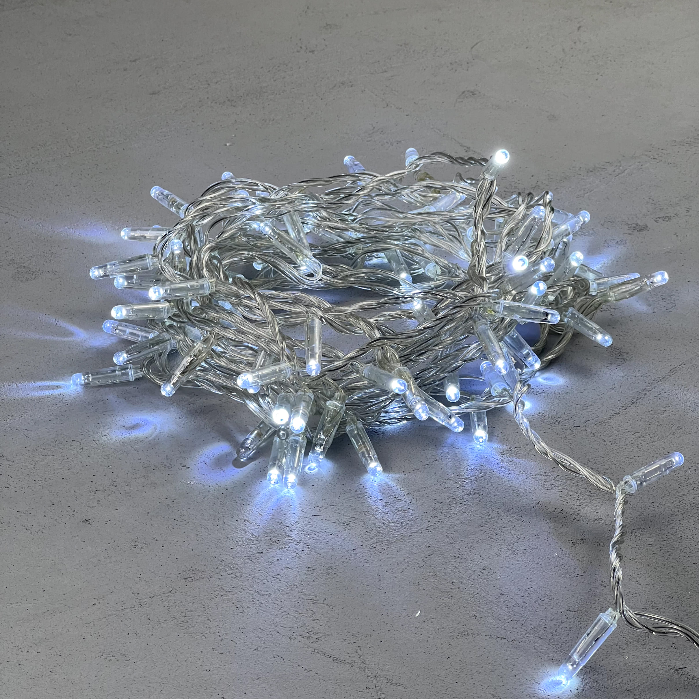 Гирлянда Нить с Колпачком 10м Белая с Мерцанием Белого Диода 24В, 100 LED, Провод Прозрачный ПВХ, IP65 PST100BLWCAP-10-1W