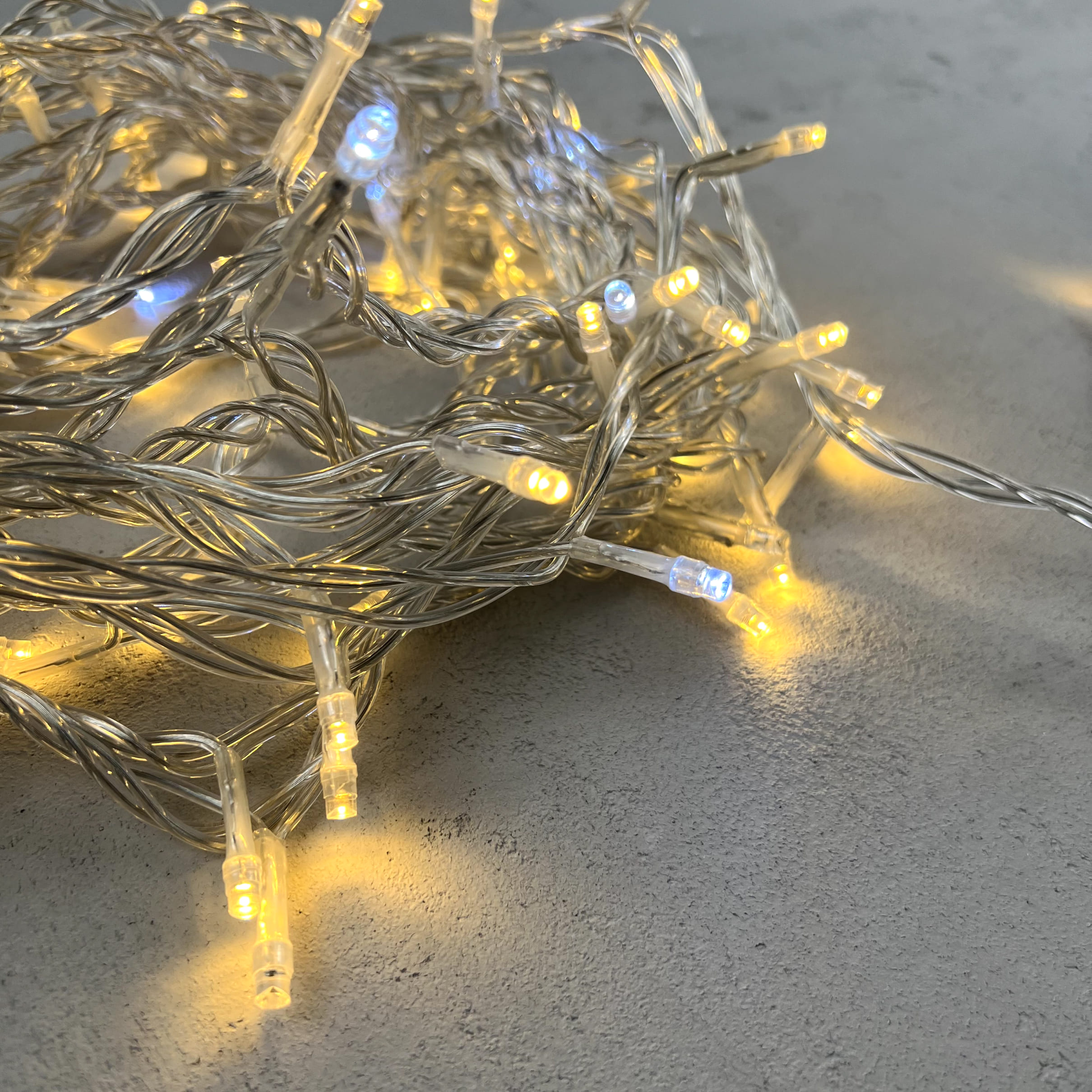 Гирлянда Нить 10м Тепло-Белая с Мерцанием Белого Диода 24В, 100 LED, Провод Прозрачный ПВХ, IP54 PST100BLW-10-1WW