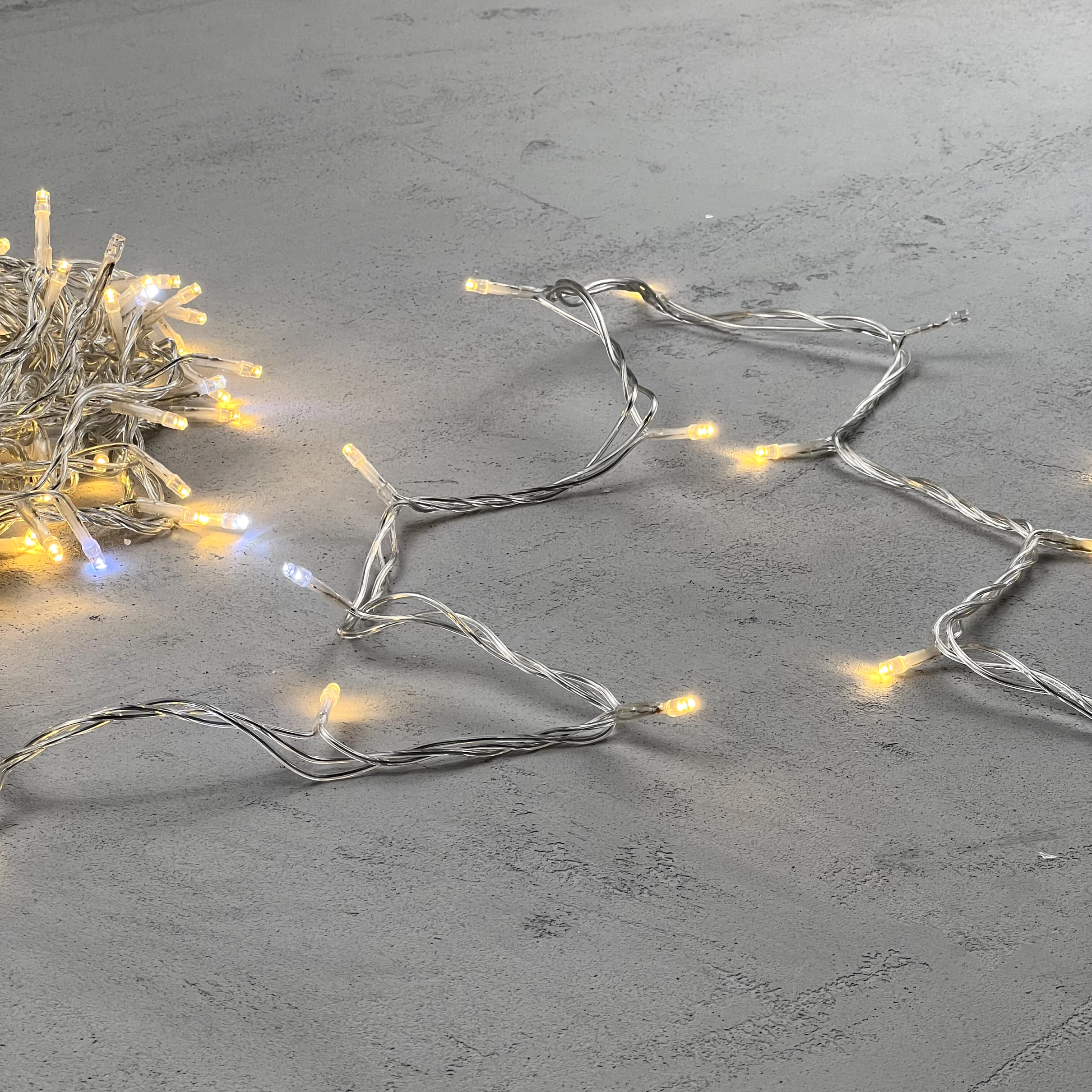 Гирлянда Нить 10м Тепло-Белая с Мерцанием Белого Диода 24В, 100 LED, Провод Прозрачный ПВХ, IP54 PST100BLW-10-1WW