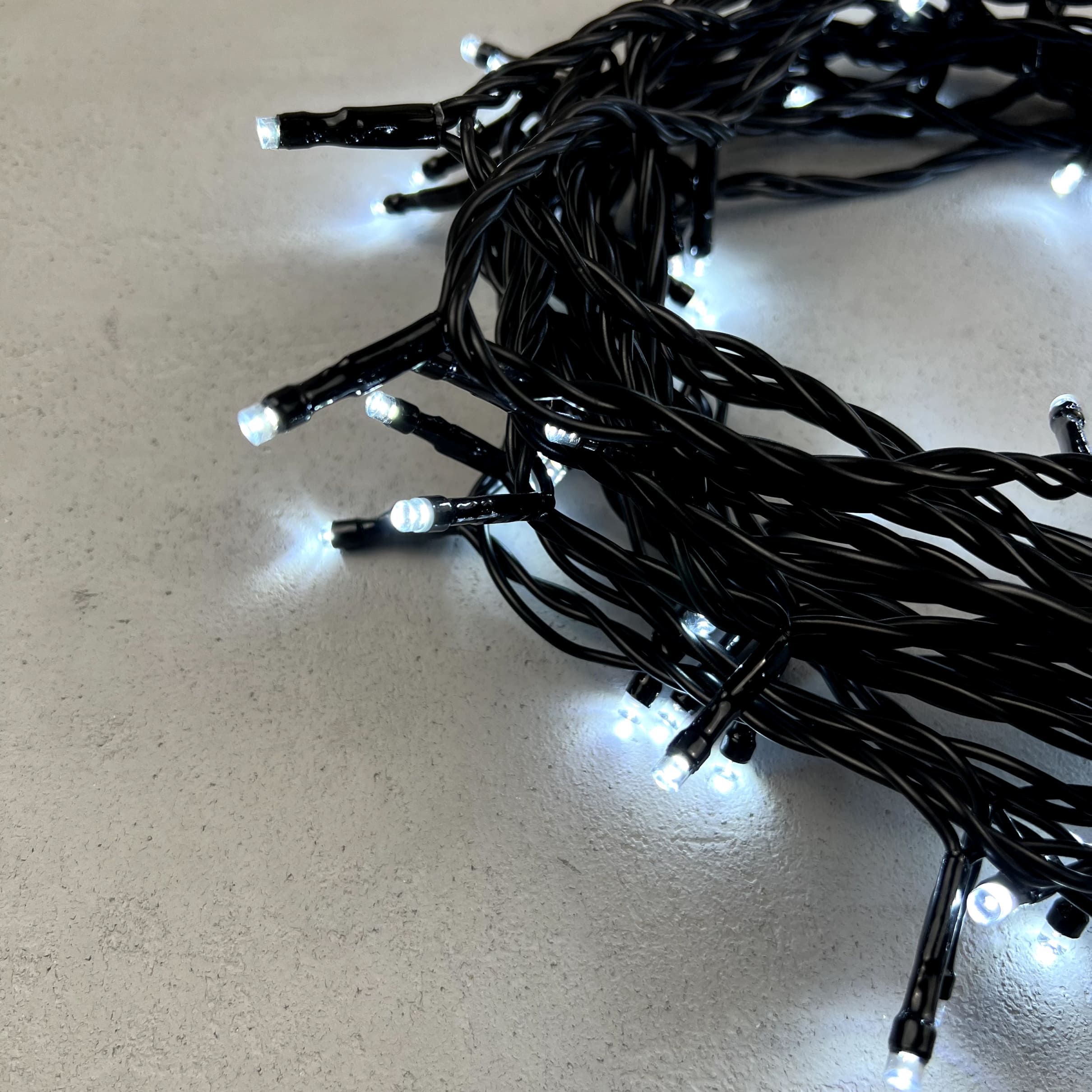 Гирлянда Нить 10м Белая 24В, 100 LED, Провод Черный ПВХ, IP54 PST100-11-1W