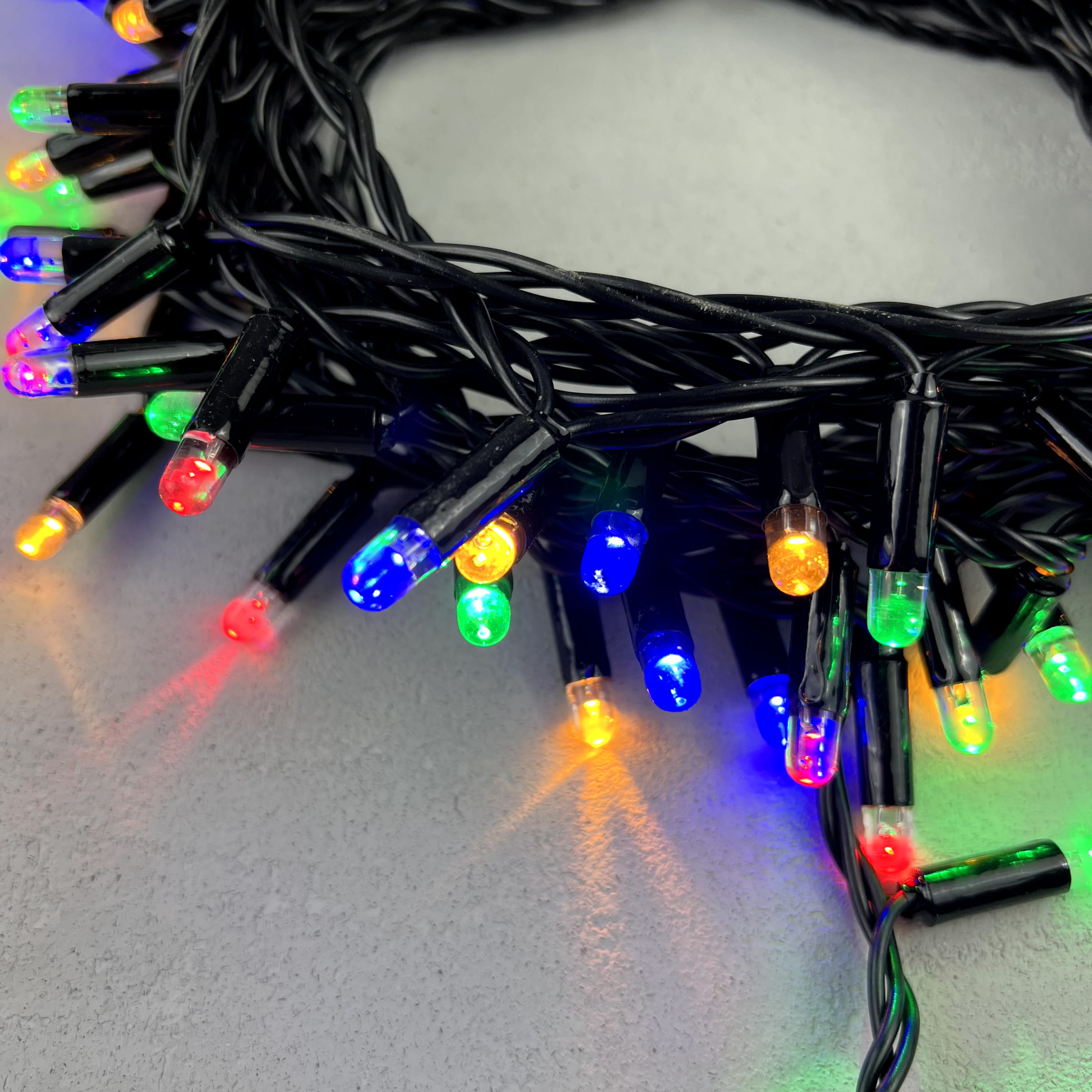 Гирлянда Нить с Колпачком 10м Разноцветная 24В, 100 LED, Провод Черный ПВХ, IP65 PST100CAP-11-1M