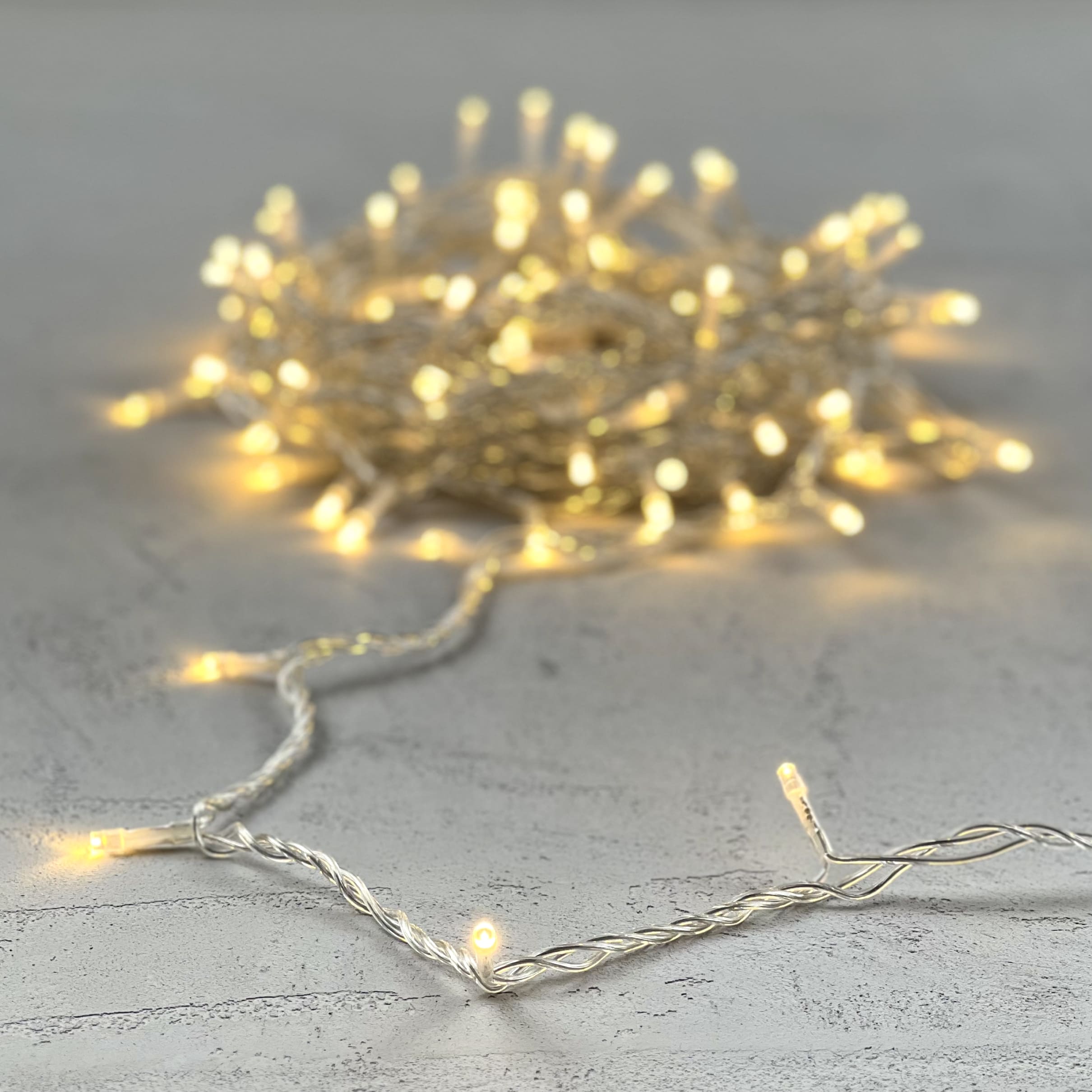 Гирлянда Нить 10м Тепло-Белая 24В, 100 LED, Провод Прозрачный ПВХ, IP54 PST100-10-1WW