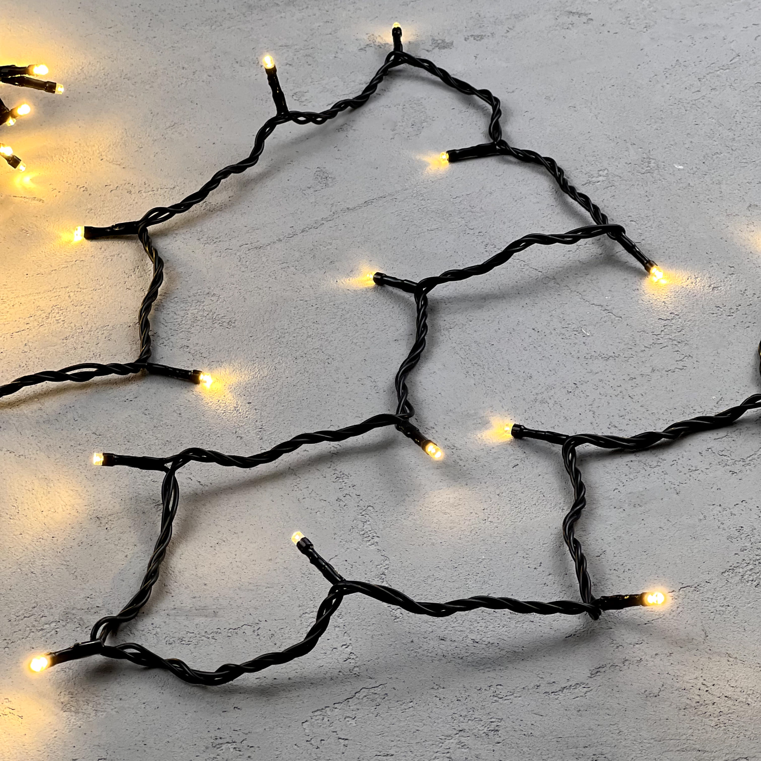 Гирлянда Нить 10м Тепло-Белая 24В, 100 LED, Провод Черный ПВХ, IP54 PST100-11-1WW