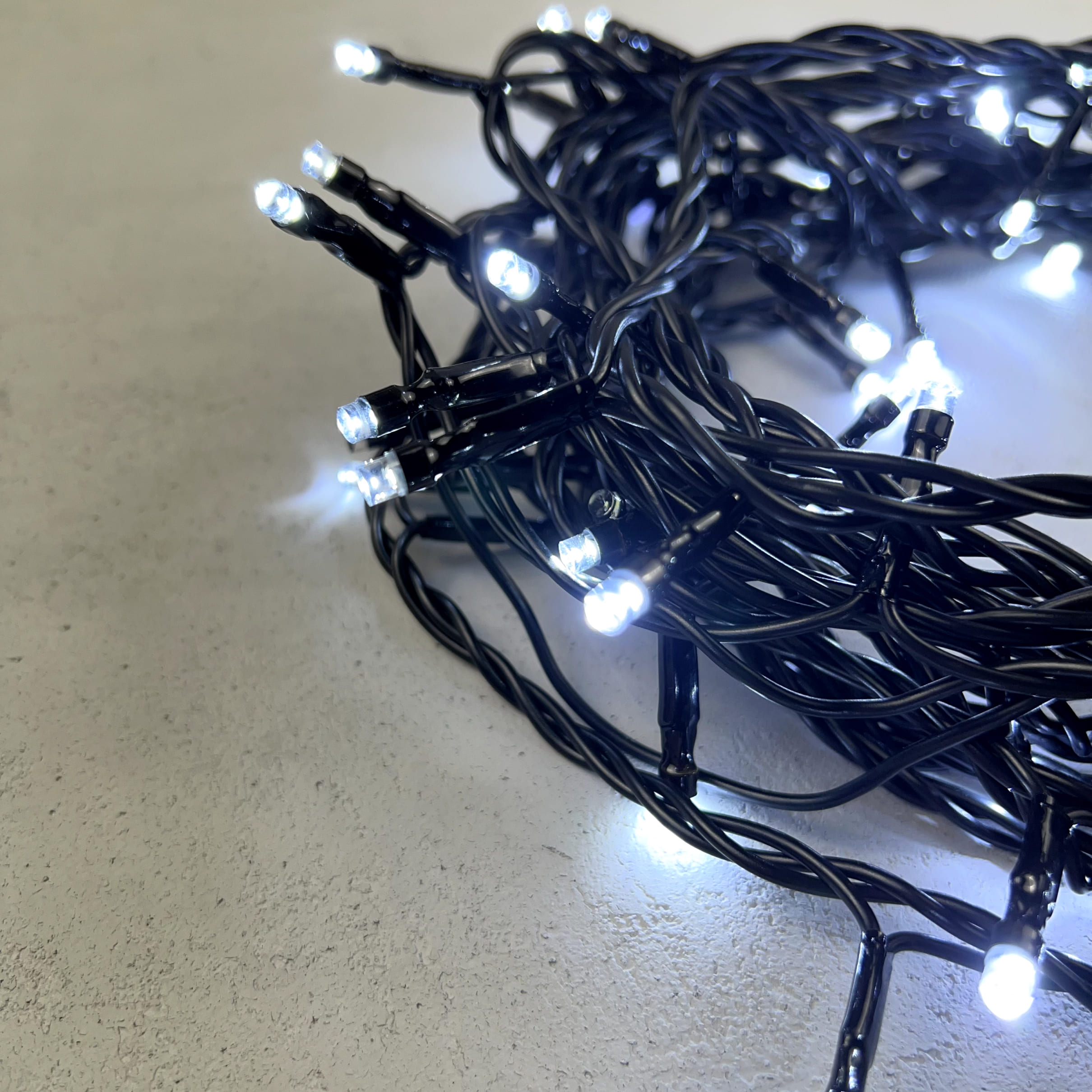 Гирлянда Нить 10м Белая с Мерцанием Белого Диода 24В, 100 LED, Провод Черный ПВХ, IP54 PST100BLW-11-1W