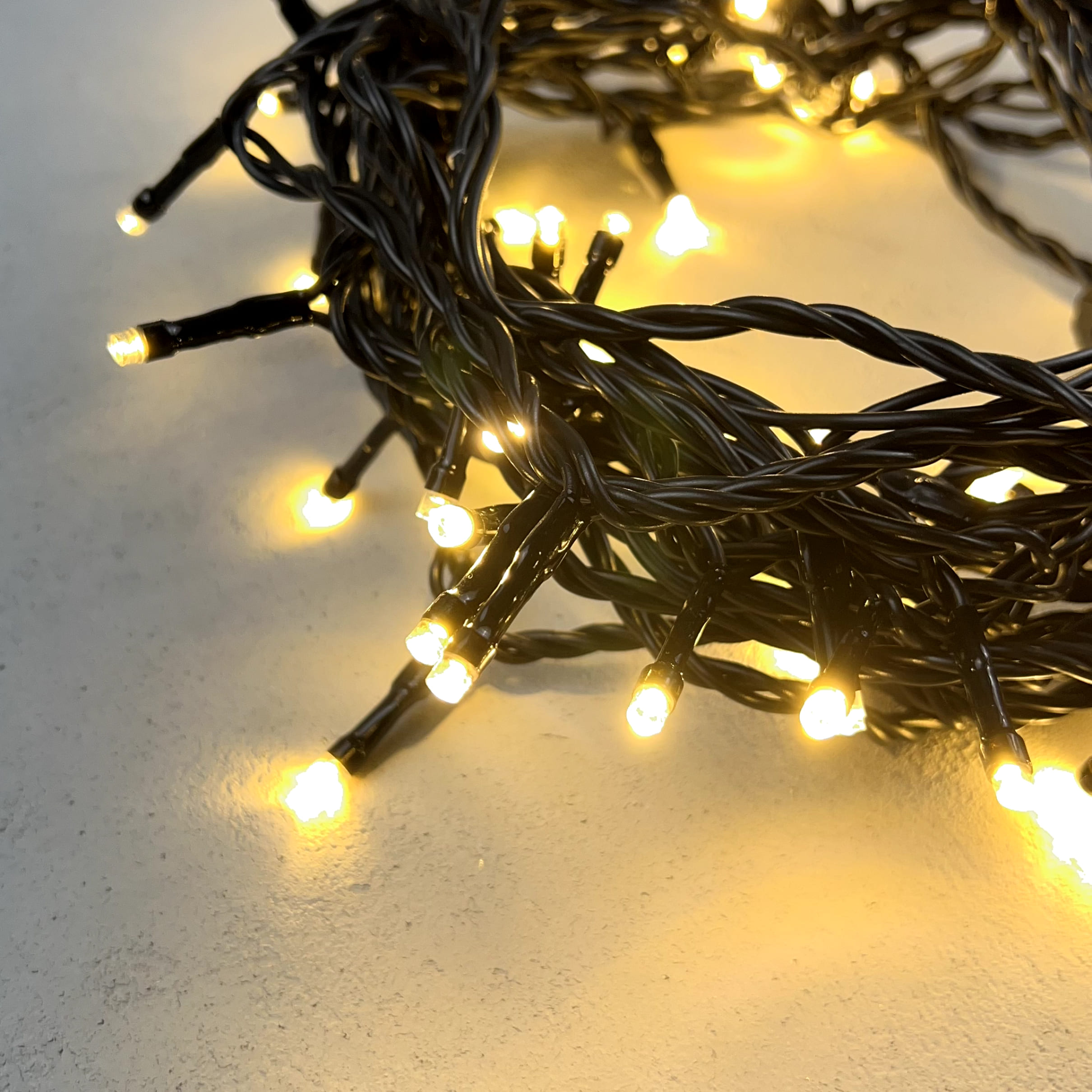 Гирлянда Нить 10м Тепло-Белая 24В, 100 LED, Провод Черный ПВХ, IP54 PST100-11-1WW