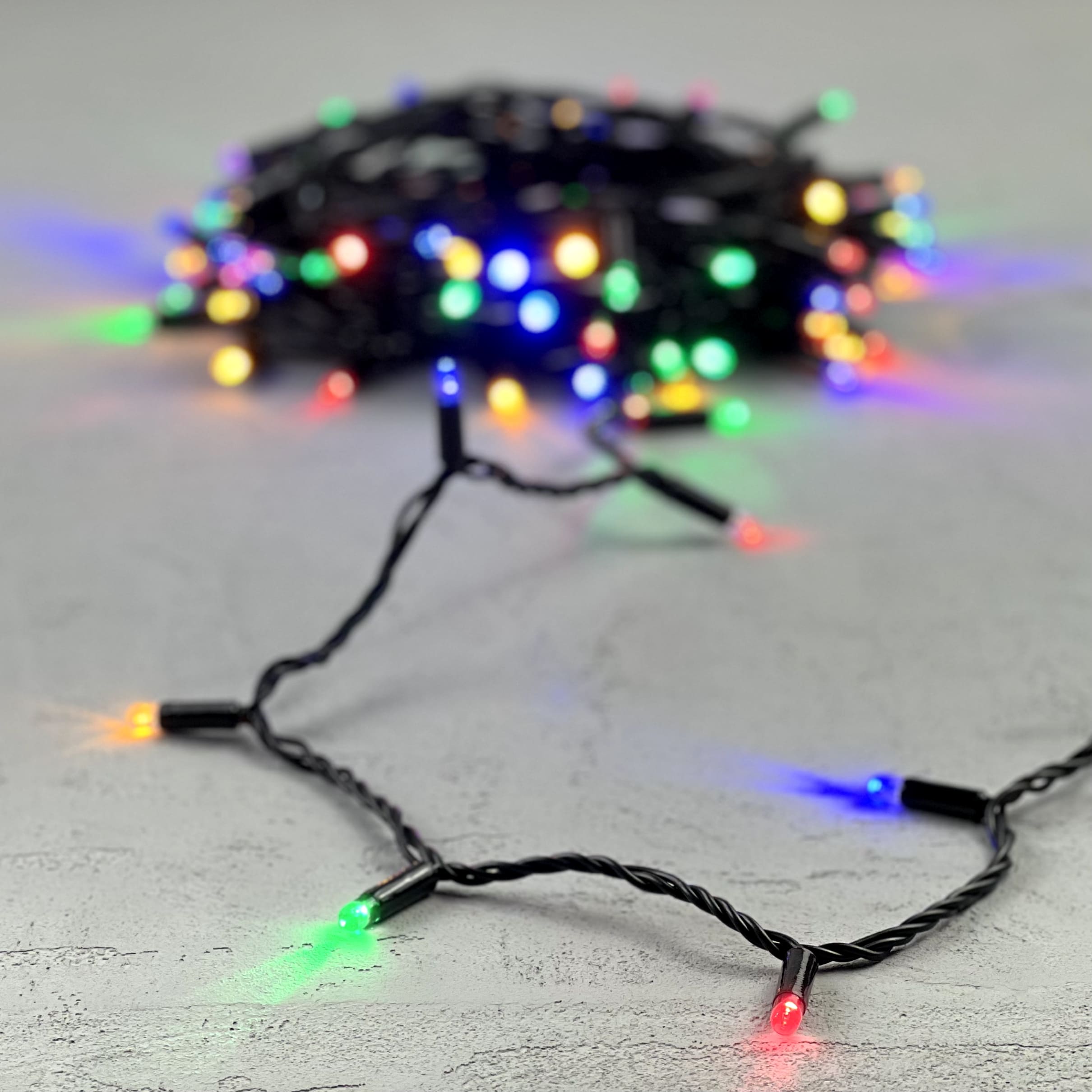 Гирлянда Нить с Колпачком 10м Разноцветная 24В, 100 LED, Провод Черный ПВХ, IP65 PST100CAP-11-1M