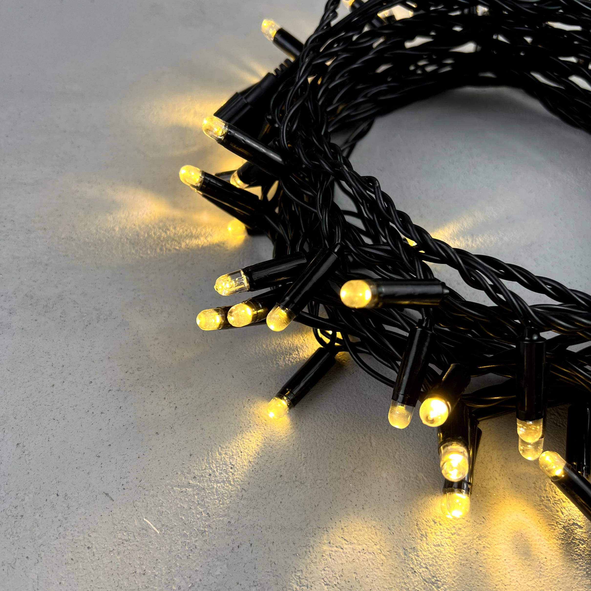 Гирлянда Нить с Колпачком 10м Тепло-Белая 24В, 100 LED, Провод Черный ПВХ, IP65 PST100CAP-11-1WW