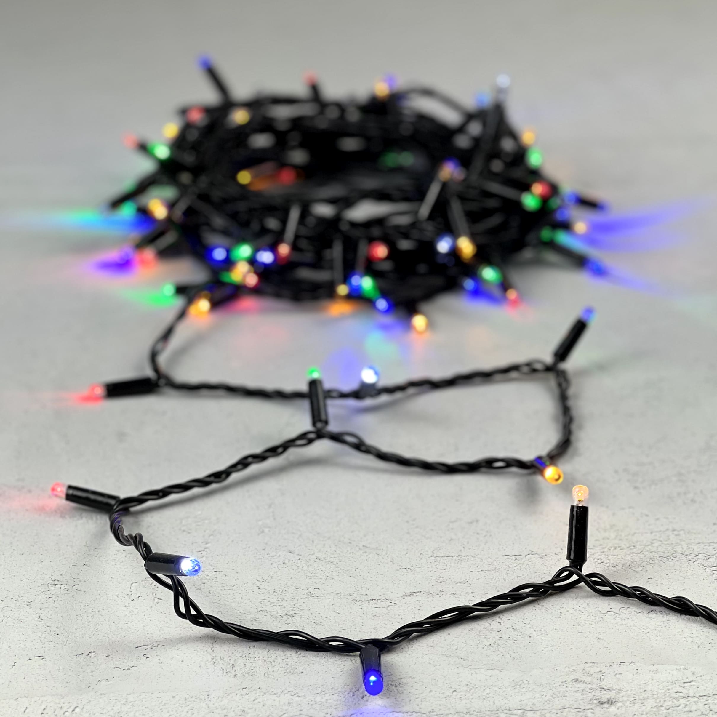 Гирлянда Нить с Колпачком 10м Разноцветная с Мерцанием Белого Диода 220В, 100 LED, Провод Черный ПВХ LTC PST100BLWCAP-11-2M PST100BLWCAP-11-2M